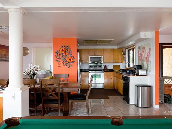 Main entrance on right and kitchen/dining area on left. On level 1.