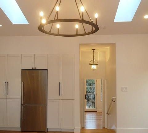 Living Room and Built in Fridge and Washer Dryer in Cabinets