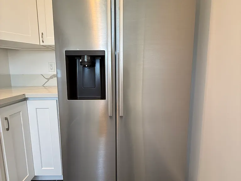 Huge 25 cubic foot Stainless Steel Refrigerator and Freezer with Built-In Ice Maker and Filtered Water Dispenser.
