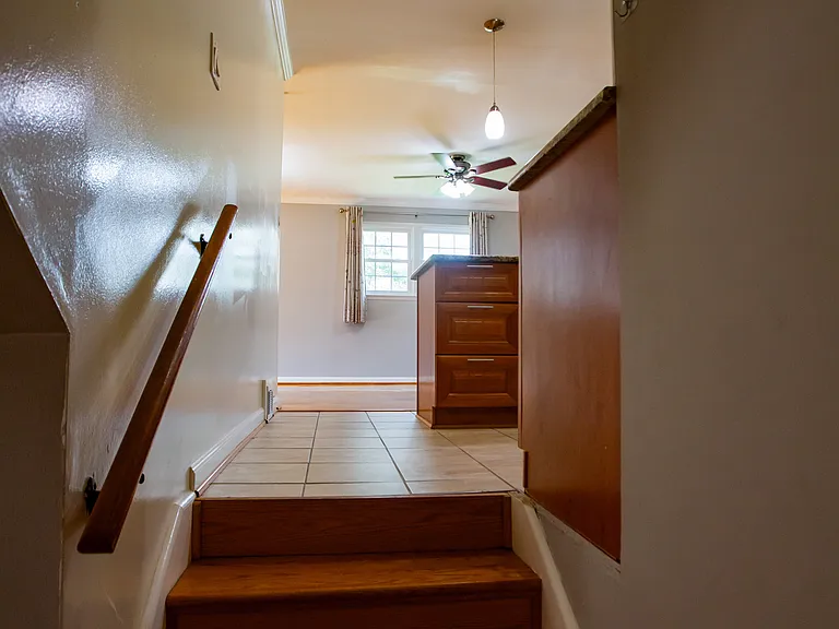 Stairs going down to 1 bedroom and Office