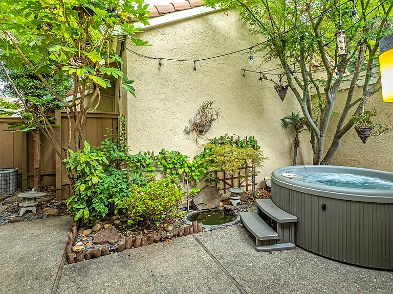 Enjoy the relaxing tranquility in your private backyard patio while simmering in the 15 jet/ multi-light Hot Tub.
