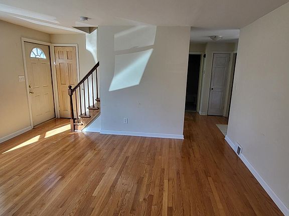The living room gets afternoon sun though the bay window