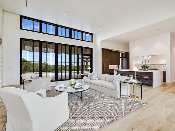 Soaring ceilings add grand appeal to the living spaces.