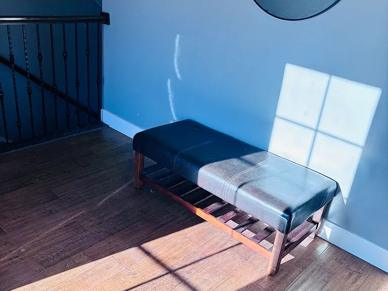 Sunroom and entrance to apartment.