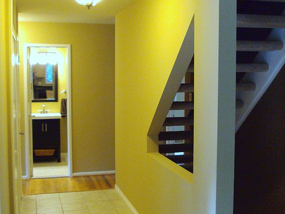 Foyer with view to stairs to upper & lower levels.