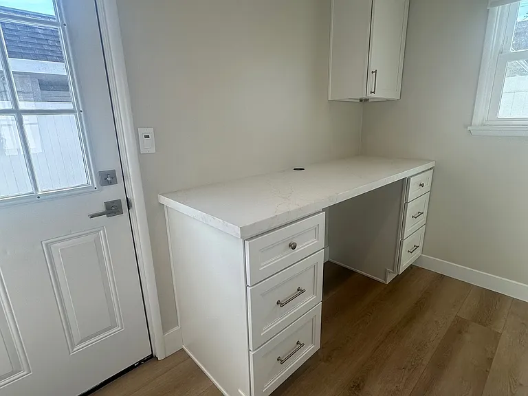 Home office off of the kitchen space with plenty of storage and counter space