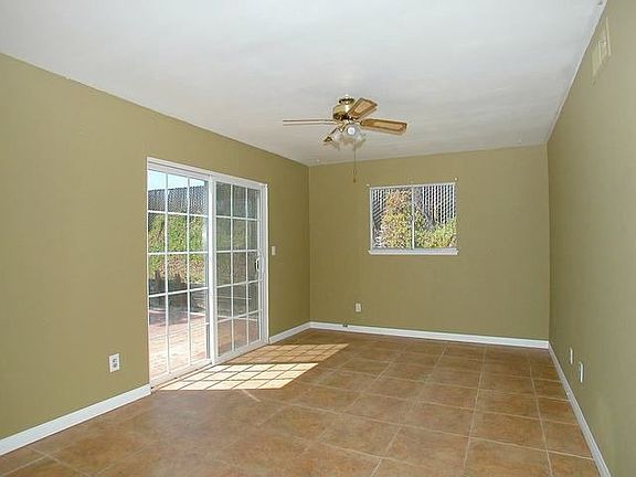 Dining room and sliding door towards the red wood deck and back yard.