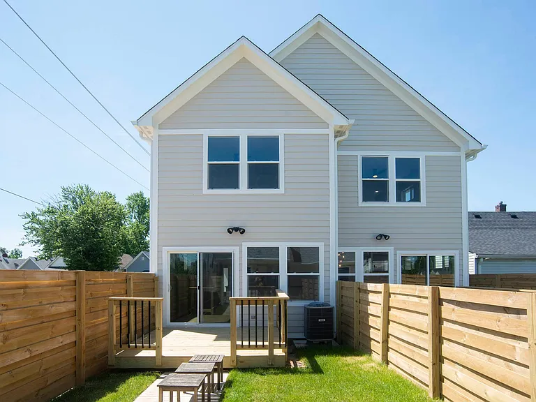 Fenced-in yard with deck