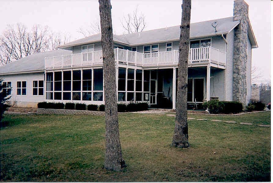 Living areas, porches & pool room all look out on the lake