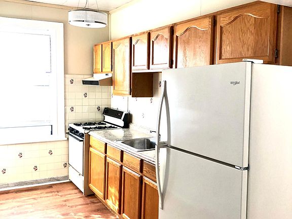 Kitchen with Brand New Large Refrigerator, New Lighting, New Flooring