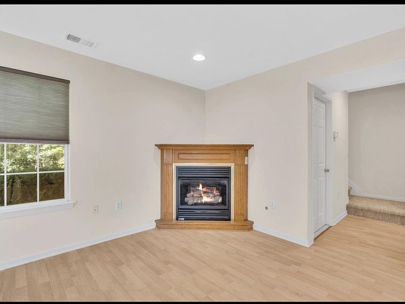 Living room - wood floor with gas fireplace