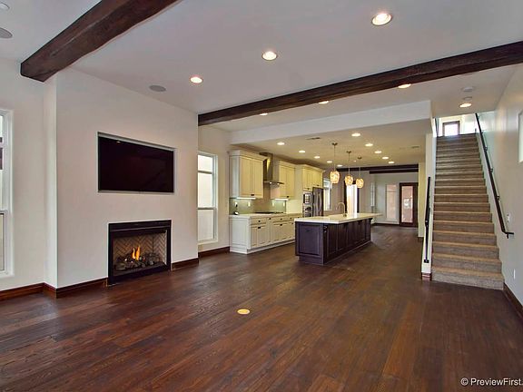 Living Room with 65 inch TV included and Gas Fireplace.