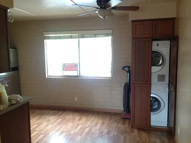 Washer and Dryer by kitchen. - 55 N Cherry Ave #116