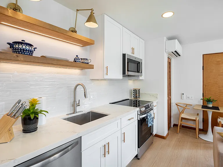 beautiful kitchen details with quartz countertops and custom lighting