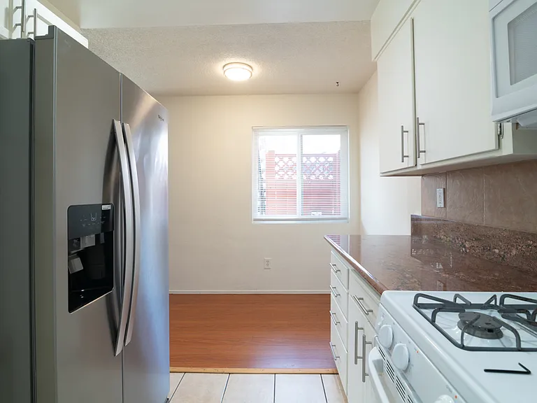 View from kitchen to small dining area