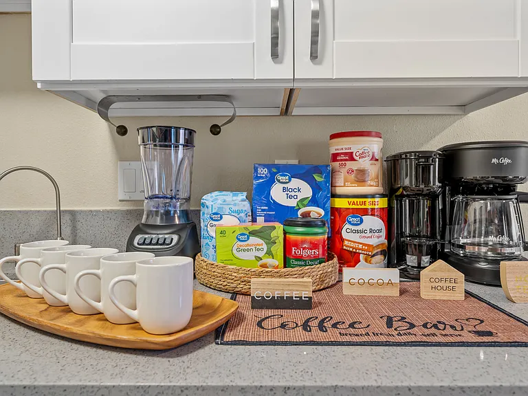 Start your day right at the fully stocked coffee bar, perfect for brewing your favorite cup.