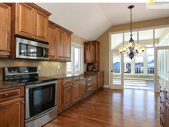Note all of the countertop work space and a convenient serving area towards the breakfast room.
