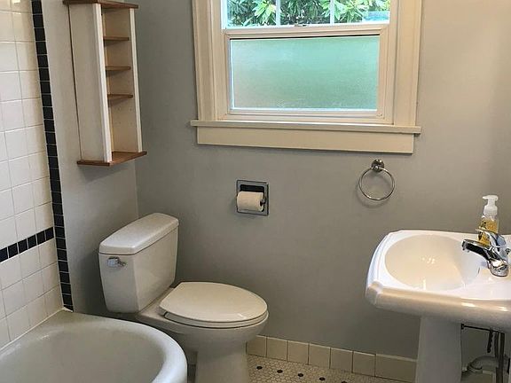 Original bath with updated w/c and pedestal sink.
