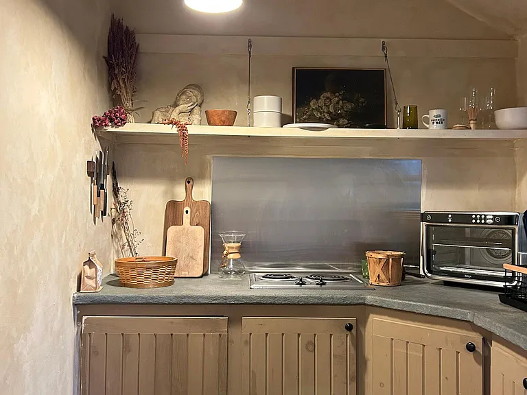 Sweet kitchen overlooking the patio and abundant nature