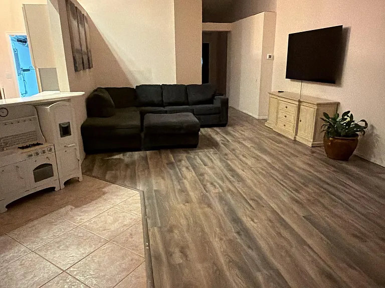 Large Living Room which is joined to Dining Room and walks out to Lenai with glass sliding doors.
