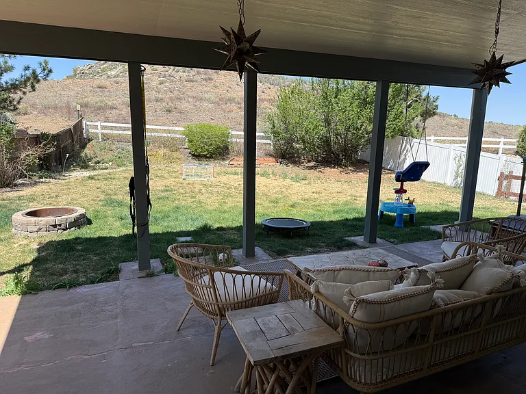 Covered back patio. Yard backs up to Mariana Butte Open Space
