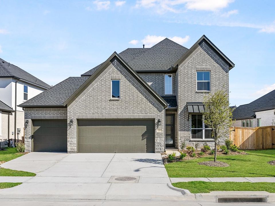 Traditional brick exterior with 3-car garage