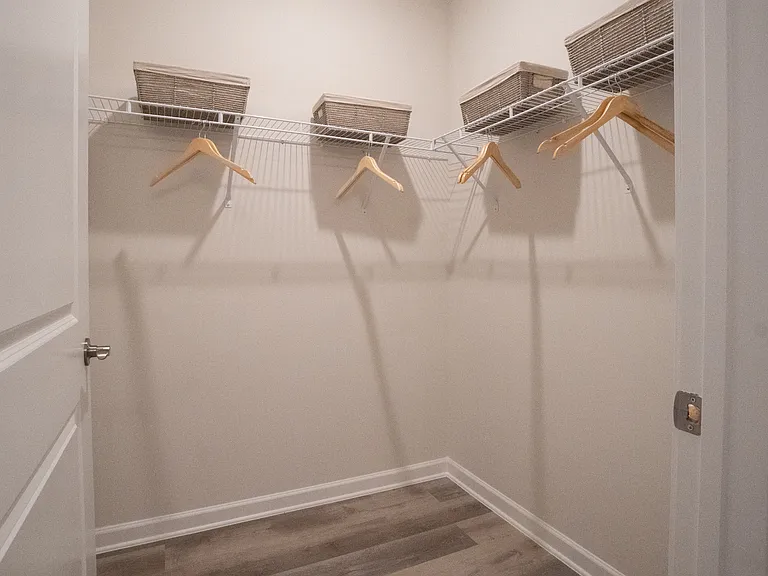 Walk-in closet in primary bathroom/bedroom