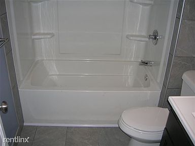 All New Tub Shower & Toilet with Tile all around