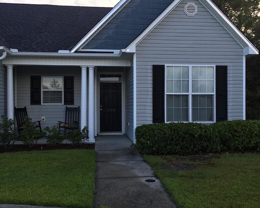 End unit with larger open lot space on the bedrooms side. 2 spots for parking for unit.