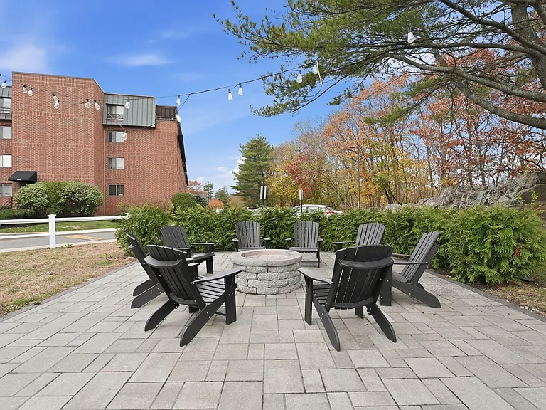 Relax in style at Eagle Rock Apartments at Swampscott. This inviting outdoor fire pit area is perfect for cozy gatherings and creating lasting memories. Embrace the serene setting and unwind with friends. Schedule your visit today!