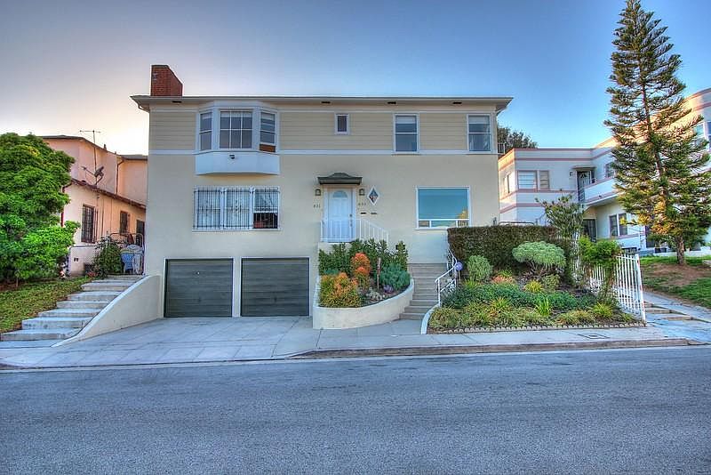Front of duplex. 1 garage spot and 1 space in driveway behin