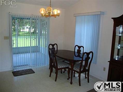 Dining room opens up to screened porch.