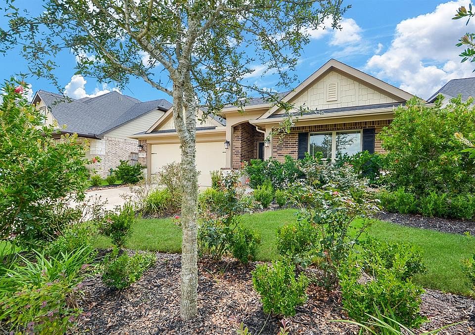 Welcome Home to 3518 Shadow Bay Ct! Upgraded landscaping to the front of the home provides lush green and flowering bottle brush