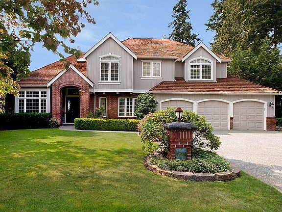 Quality Lozier Home; traditional wood and brick