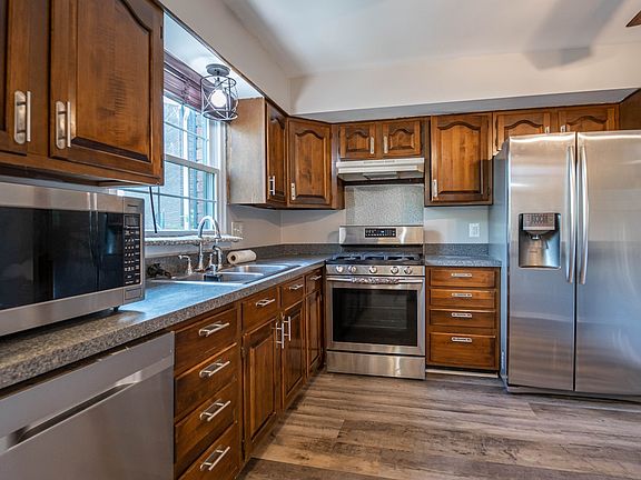 functional kitchen with stainless steel appliances , new sink and faucet