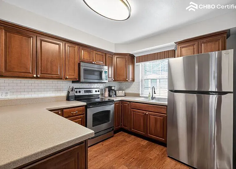 kitchen if equipped with cooking utensils and dinnerware