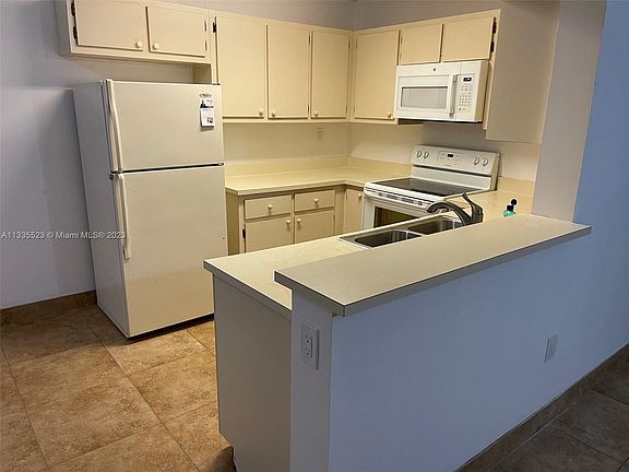 4th image of 9491 Palm Cir S APT 203