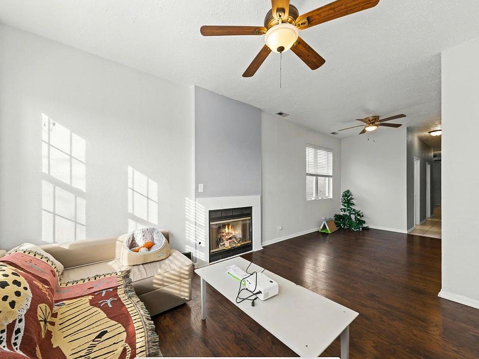 Spacious living room large enough for a full sofa on one wall, and full love seat on the other, and a comfortable dining area.