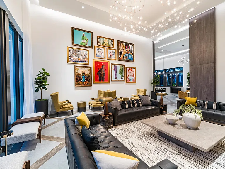 A gallery-inspired resident lounge where curated art, sculptural lighting, and layered seating come together in a striking, design-forward setting.
