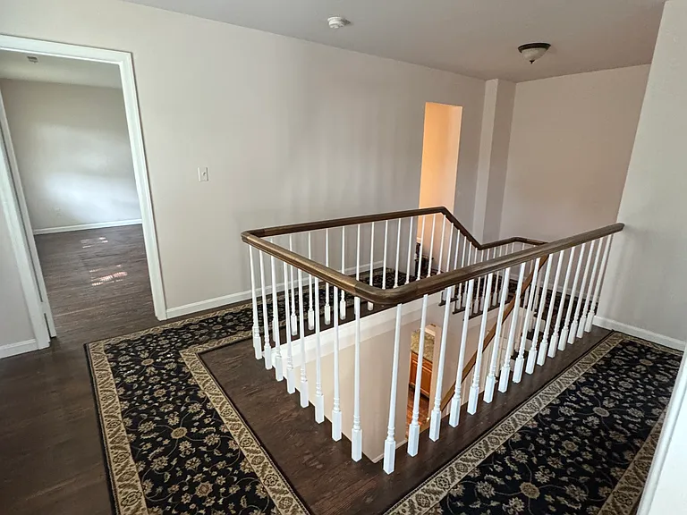 Second floor landing, hall to primary bedroom and hall door to bathroom.