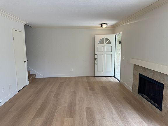 Entry opens to all new vinyl plank flooring upstairs and downstairs