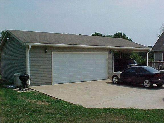 detached double garage AND a carport 