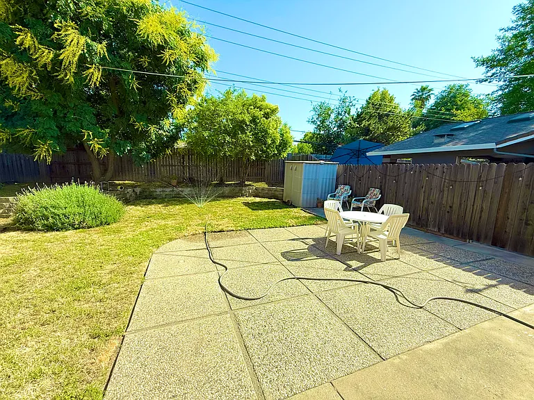 Beautiful backyard with new flower beds. Landlord provides gardener.