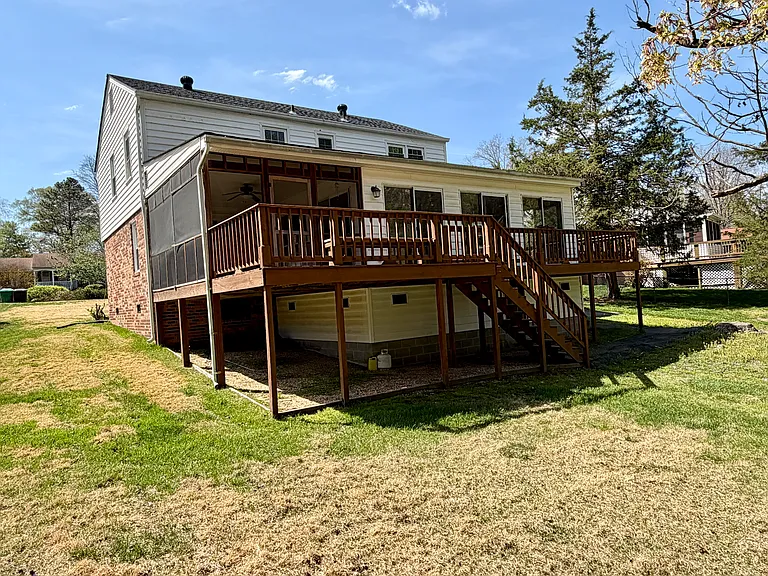 Large sunroom addition with a screened porch and deck for entertaining or enjoying time outside