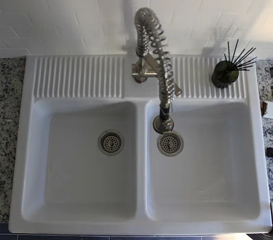 Large kitchen farm sink and new cabinets