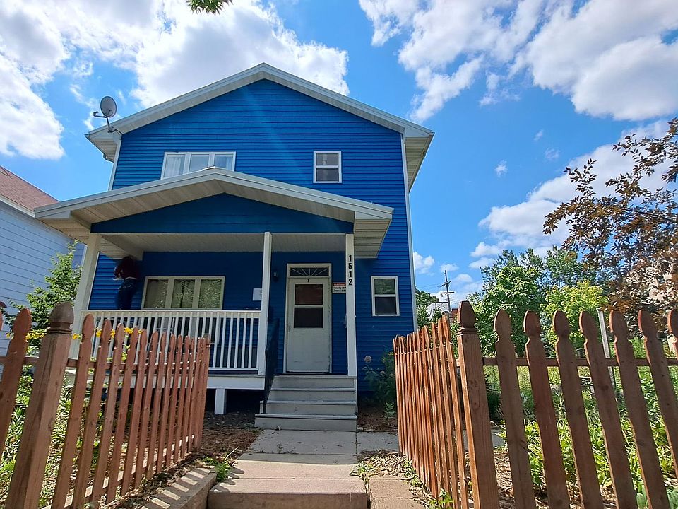 Entrance to unit one and access to other units is on a side walk North of entrance.