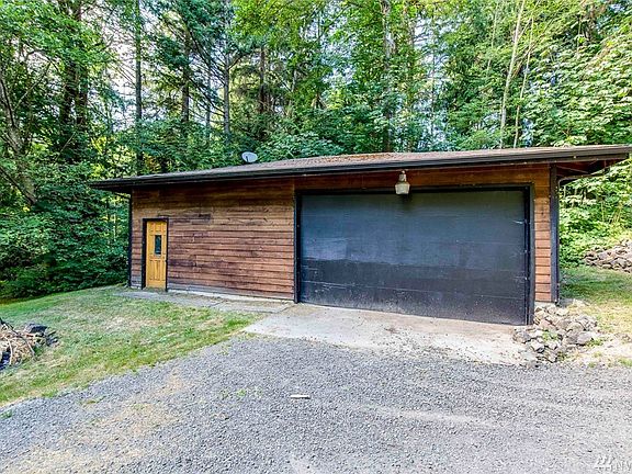 The detached garage is a great place for hobbies or the drummer/band member.  Carry on! 