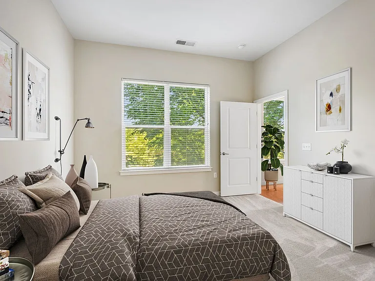 Retreat to an expansive primary bedroom designed with rest, relaxation, and generous space in mind.