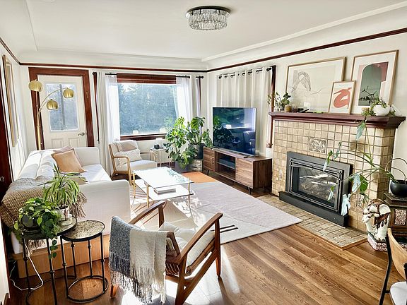 Living Room with balcony & gas fireplace