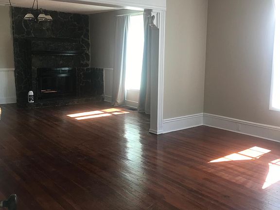 Open living area - with original wood floors! Plus a fireplace!